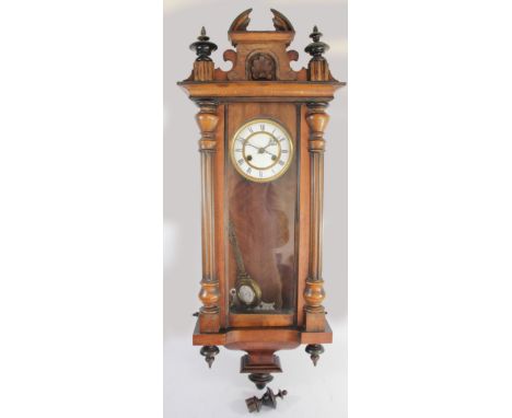 Friedrich Mauthe, Schwenningen, Germany, a late 19th century Vienna style walnut and ebonised Vienna wall clock, white enamel