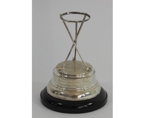 A silver golfing presentation trophy, Birmingham 1937, composed of three crossed clubs with a band to support a ball, raised 