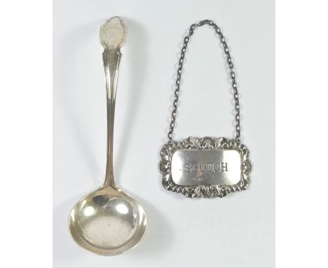 A silver sauce ladle, Sheffield 1970 and a silver SCOTCH bottle label, Sheffield 1963 (2) 70gm. 