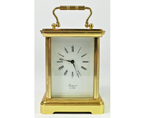 Rapport, a gilt brass half and hour striking carriage clock, white enamel dial, the 13 jewel signed movement, numbered 1146, 