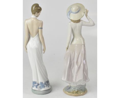 LLADRÓ; a figure of a young lady in Edwardian day suit with straw bonnet and one Nao figure in couture evening dress with ups