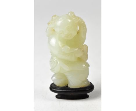 A Chinese jade figure of a woman holding branches, height 6cm, on a wooden stand. CONDITION REPORT Generally good condition, 