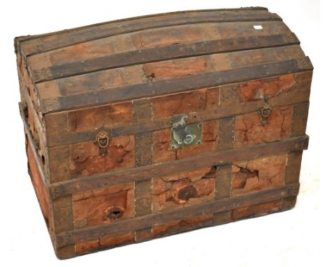 A 19th century metal bound leather covered dome topped trunk, with metal mounts and locks, 59 x 77 x 46cm.