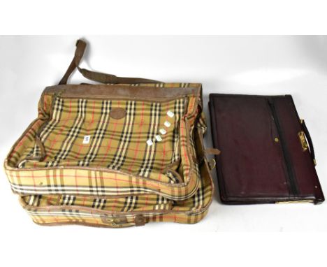 BURBERRY; a vintage fold-over suit carrier in Burberry check with brown leather trim, with horseback knight ghosted intermitt