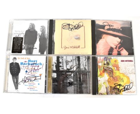 VARIOUS ARTISTS; six signed CDs including Joni Mitchell, Burt Bacharach and Robert Plant (6).We have not authenticated these 