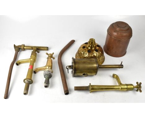 A good quantity of mixed metalware to include various brass taps and bathroom fittings, a cast iron and enamelled tabletop st