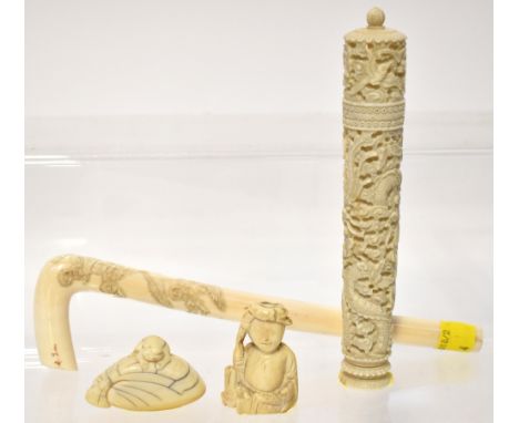 A mixed group of 19th century ivory items to include a parasol handle carved with flying cranes within prunus branches, a sma