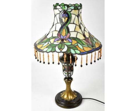 A Tiffany-style table lamp, Classical urn-shaped column to stepped circular base, with multi-coloured floral decorated shade 