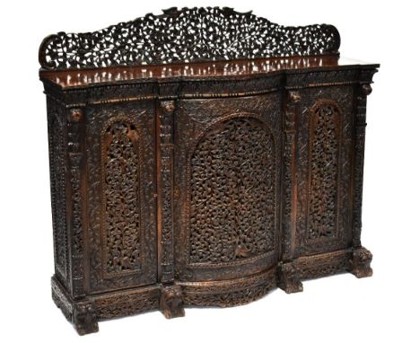 A 19th century Anglo-Indian rosewood profusely carved sideboard, with pierced foliate decoration throughout, with carved lion