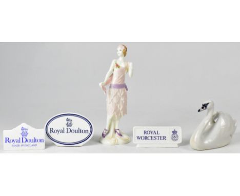 ROYAL WORCESTER; a figure form the 1920s Vogue collection, 'Bea 1922', a Royal Copenhagen model of a swan, 11 x 17cm, also tw