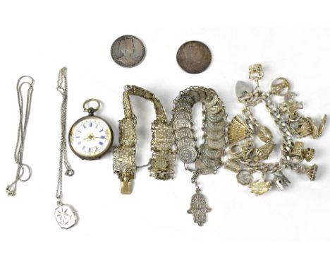 A hallmarked silver charm bracelet on flat link chain with heart shaped padlock and fifteen various charms together with one 