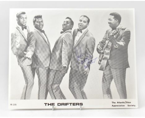 THE DRIFTERS; a black and white photograph bearing the signature of Johnny Moore, 20 x 25.25cm.We have not authenticated this