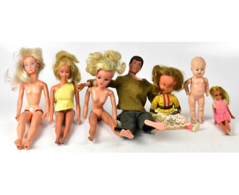 A quantity of vintage and later plastic dolls of various sizes and outfits and a Palitoy Action Man.
