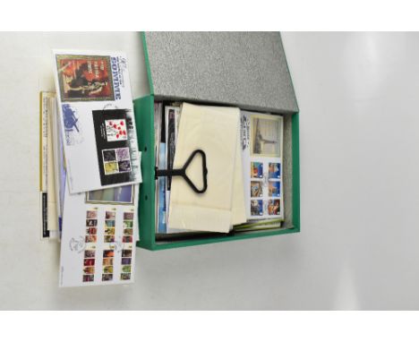 A green box folder containing various first day covers to include Motor Racing, William Shakespeare, Castles, Mail Coach, The