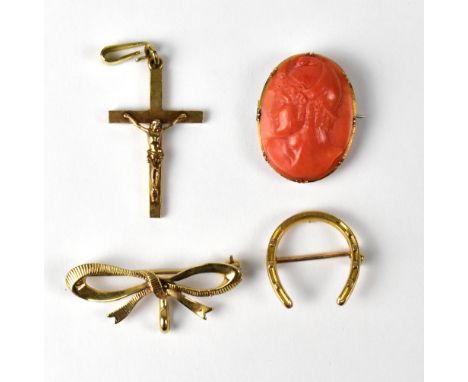 A 9ct yellow gold crucifix, a 9ct yellow gold bow brooch, approx 7g, a 15ct yellow gold horseshoe brooch, approx 2g, and a sm