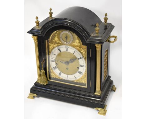 A good and large late 19th century ebonised bracket clock, the arched mouldings with brass finials, above arched brass dial w