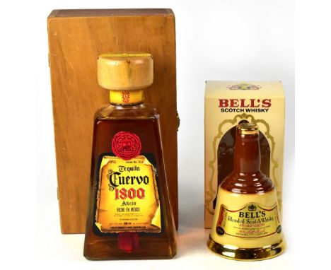 A cased bottle of Cuerro 1800 tequila, 750ml, and a Bell's whisky decanter, 18.75cl (2).