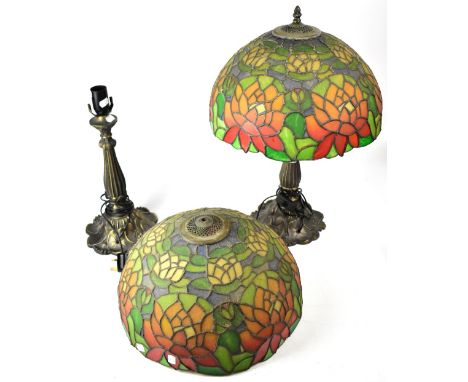 A pair of Tiffany-style table lamps, metal base with spreading Art Nouveau style floral decoration, each with green and red c