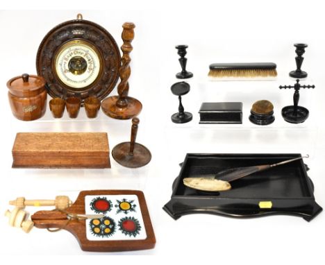 A vintage ebony dressing table set comprising a tray, brush, shoehorn with button hook, buffer, ring holder, candlesticks, li
