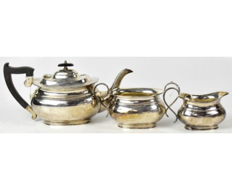 A George V hallmarked silver three-piece tea service comprising teapot, milk jug and twin-handled sucrier, Viner Ltd (Emile V