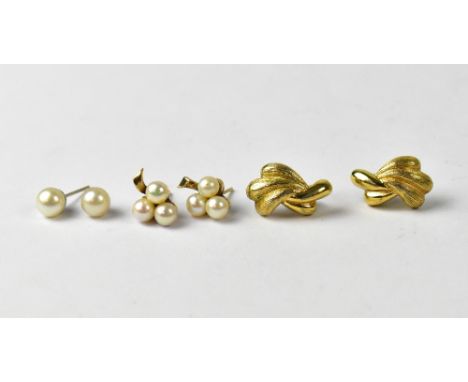 A pair of vintage Christian Dior yellow metal stud earrings , a pair of yellow metal stud earrings set with three small pearl
