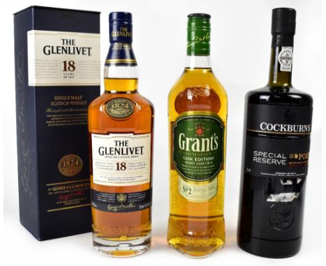 A boxed bottle of The Glenlivet single malt Scotch whisky, 700ml, a bottle of Grants blended Scotch whisky, 700ml, and a bott