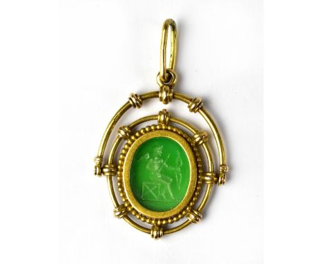 A late 19th/early 20th century green intaglio depicting a seated Eros with wings and bow and arrow, in yellow metal swivel ne