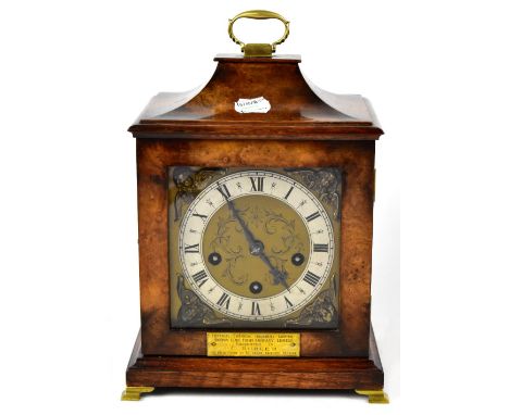 A German walnut veneered mantel clock with brass dial and silvered chapter ring set with Roman numerals, the movement with mu
