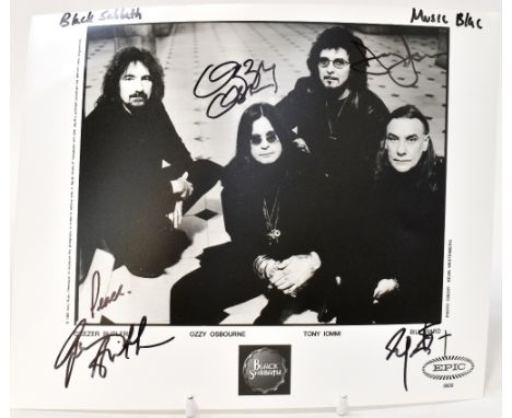 BLACK SABBATH; a black and white photograph bearing the four signatures of Ozzy Osbourne, Geezer Butler, Tony Iommi and Bill 