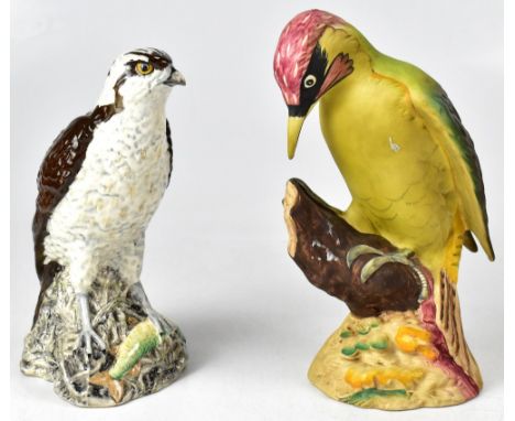 BESWICK; a large figure of a Green Woodpecker on a naturalistic tree stump and floral covered base, impressed number to base 