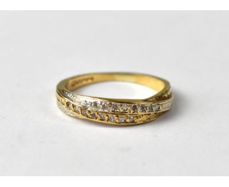 A 9ct gold cross over channel set diamond ring, size I, approx 1.6g.