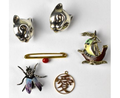 A pair of Continental silver earrings in the form of cats' heads, marked 925, with both clip-on fittings and fittings for pie