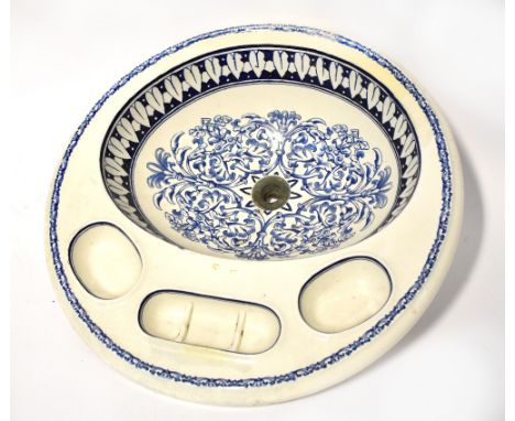 BROWN-WESTHEAD, MOORE &amp; CO, TEUTON; a Victorian blue and white transfer decorated washbasin, with three additional soap d
