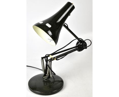 A vintage dark green Anglepoise lamp.