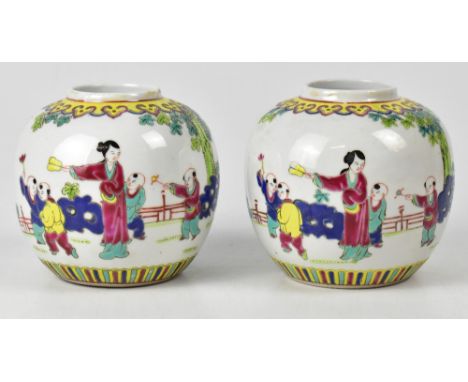A pair of 20th century Chinese ginger jars painted in famille verte pallet with scenes of children playing in a garden, moder