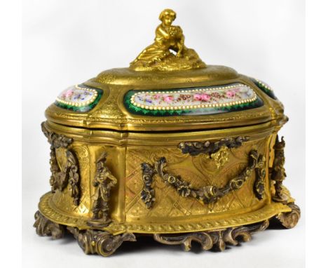 A 19th century French gilt metal and enamelled casket by Tahan of Paris, c1880, the oval casket with domed cover and bronzed 