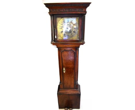 GABRIEL SMITH, CHESTER; an 18th century oak longcase clock, stepped carved frieze above two slender pillars, the brass dial s