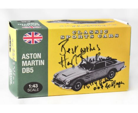 JAMES BOND; a Classic Sports Cars diecast model of an Aston Martin DB5, bearing the signature and inscription from Honor Blac