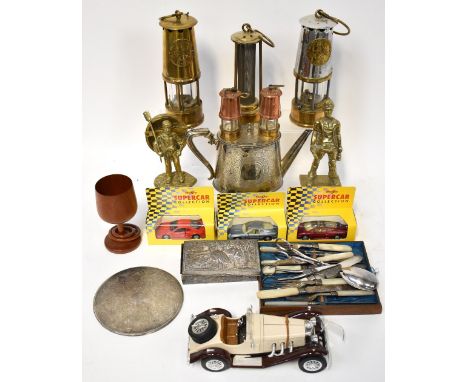 A collectors' lot comprising three safety lamps, one stamped Protector Lamp and Lighting Type 6MO Safety Lamp, Approval No. B