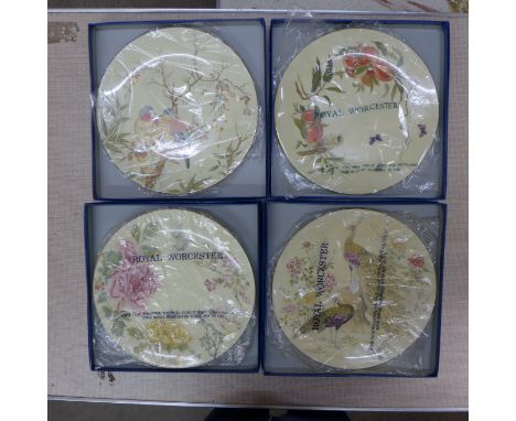 Royal Worcester wall plates depicting the Four Seasons, boxed