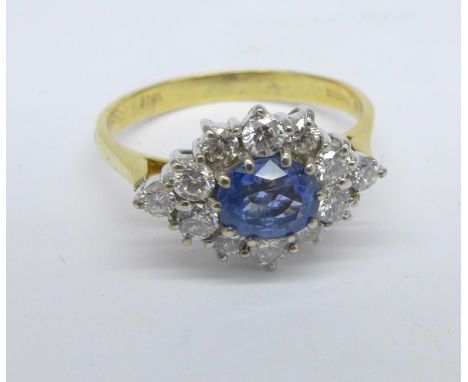 An 18ct gold, sapphire and diamond cluster ring, 0.60ct sapphire and 0.65ct diamond weight, Sheffield 1988, 4.1g, R