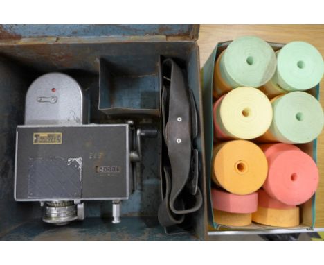 A Setright bus ticket machine and a box of spare rolls