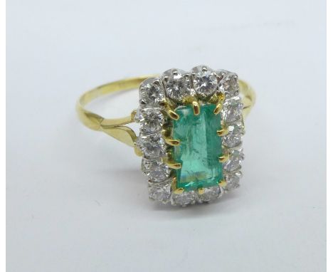 An 18ct gold, emerald and diamond cluster ring, 0.75ct emerald plus 0.70ct diamond, weight 3.6g, T