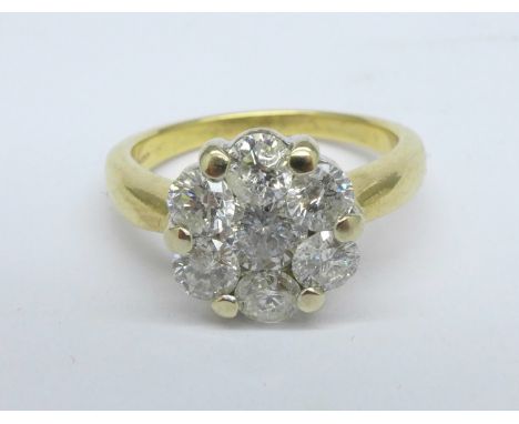 An 18ct gold and seven stone diamond cluster ring, c.1.25ct diamond weight, 5.1g, L