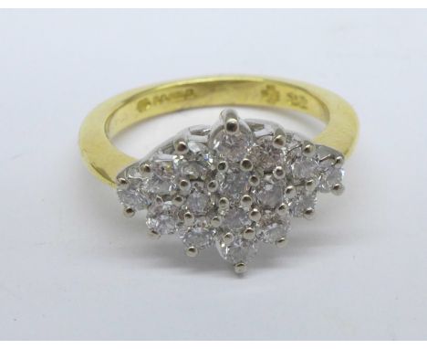 An 18ct gold and sixteen diamond cluster ring, 0.65ct diamond weight, 4.4g, K