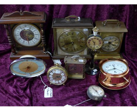 Nine various clocks including a Junghans carriage clock