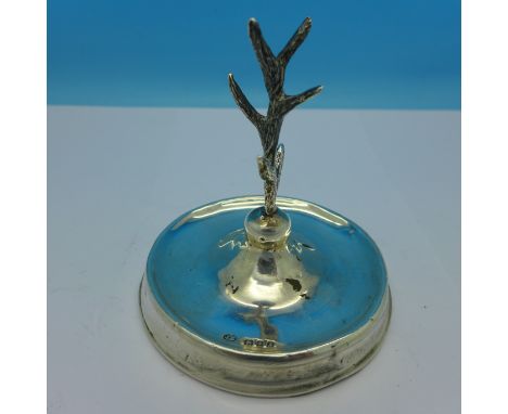 A silver ring tree