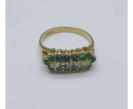 A 9ct gold, emerald and white stone ring, 2.1g