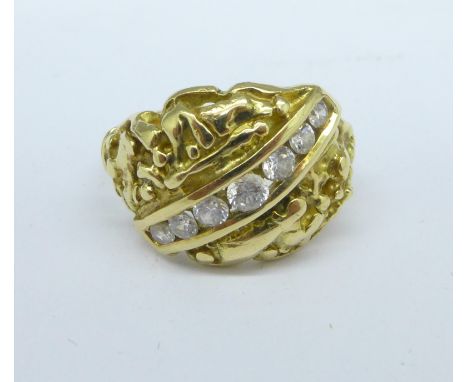 An 18ct gold and white stone ring, 7.2g, M