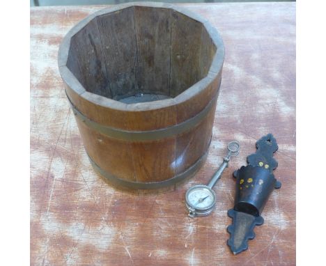 An oak jardiniere, a papier mache match holder and striker and a walkers compass with magnifying lenses